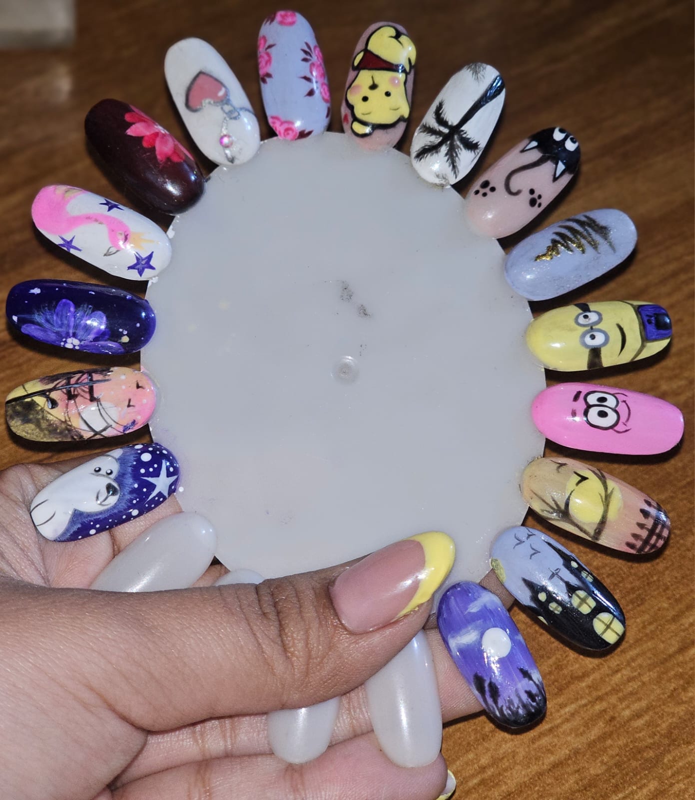 Close-up of hand-painted nail art practice set